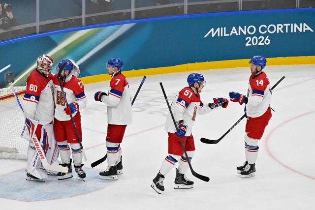 Czech Republic's players celebrate after winning men's preliminary round Group A Ice Hockey match between France and Czech Republic at the Milano Santagiulia Ice Hockey Arena during the Milano Cortina 2026 Winter Olympic Games in Milan, on February 13, 2026. (Photo by Alexander NEMENOV / AFP)