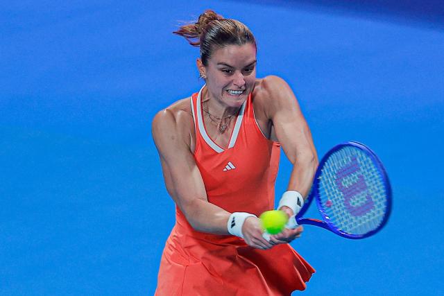 Greece's Maria Sakkari hits a return against Czech Republic's Karolina Muchova during their women’s singles semi-final match at the Qatar Open tennis tournament in Doha on February 13, 2026. (Photo by Karim JAAFAR / AFP)
