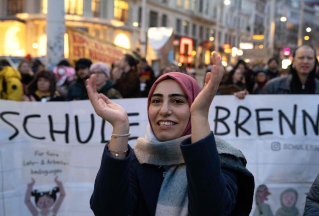 Hundreds of demontrators attend a protest, organized by coalition of 20 civil society organizations in Austria, against the headscarf ban in schools, in Vienna, Austria on February 13, 2026. The protests are in response to the "awareness phase" of a new, stricter headscarf ban for girls under 14 in schools, which began in Vienna and Lower Austria following the semester break. The law, which takes full effect in the 2026/27 school year, prohibits "ideologically or religiously influenced" head coverings in schools, with fines for parents ranging from 150 to 800 euros. (Photo by Joe Klamar / AFP)