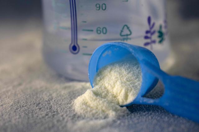 (FILES) This photograph shows a spoonfull of infant milk formula in Quimper, western France January 29, 2026. The public health division of the Paris prosecutor's office has opened five investigations into infant formula contaminated with cereulide toxin from the bacterium Bacillus cereus, the Paris prosecutor announced in a statement on February 13, 2026. (Photo by Fred TANNEAU / AFP)
