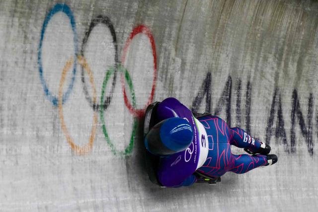 Britain's Marcus Wyatt competes in the skeleton men's heat 3 at Cortina Sliding Centre during the Milano Cortina 2026 Winter Olympic Games in Cortina d'Ampezzo on February 13, 2026. (Photo by Stefano RELLANDINI / AFP)