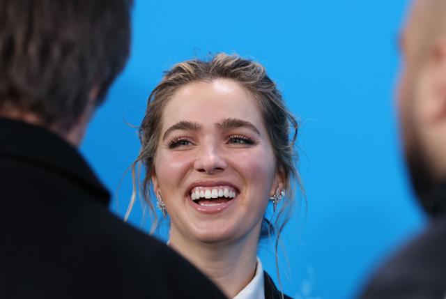 US actress Haley Lu Richardson reacts during a photo call for the film 'Good Luck, Have Fun, Don’t Die' presented in Berlinale Special Gala at the 76th Berlinale, Europe's first major film festival of the year, in Berlin on February 13, 2026. (Photo by Ronny HARTMANN / AFP)
