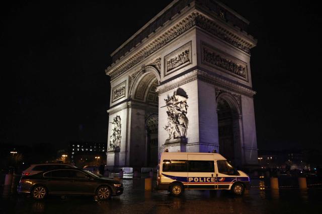 French police officers block the area around the Arc de Triomphe in Paris on February 13, 2026, after police shot a knife-wielding man under who allegedly threatened officers carrying out a ceremonial duty at the famed Paris landmark. The suspect was hospitalised after being shot while menacing officers as they rekindled the flame at the tomb of the unknown soldier, according to the same source. France's national anti-terrorism prosecutor's office announced it has taken charge of the case. (Photo by Guillaume BAPTISTE / AFP)