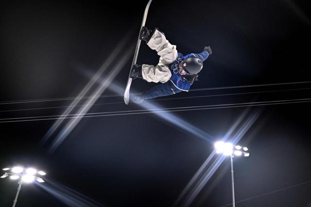 Japan's Ayumu Hirano competes in the snowboard men's halfpipe final run 2 during the Milano Cortina 2026 Winter Olympic Games at Livigno Snow Park, in Livigno (Valtellina), on February 13, 2026. (Photo by Kirill KUDRYAVTSEV / AFP)