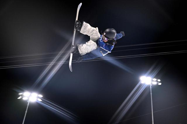 Japan's Ayumu Hirano competes in the snowboard men's halfpipe final run 2 during the Milano Cortina 2026 Winter Olympic Games at Livigno Snow Park, in Livigno (Valtellina), on February 13, 2026. (Photo by Kirill KUDRYAVTSEV / AFP)
