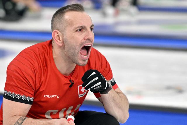 Switzerland's Sven Michel reacts during the curling men's round robin between Switzerland and China during the Milano Cortina 2026 Winter Olympic Games at the Cortina Curling Olympic Stadium in Cortina d’Ampezzo on February 13, 2026. (Photo by Tiziana FABI / AFP)