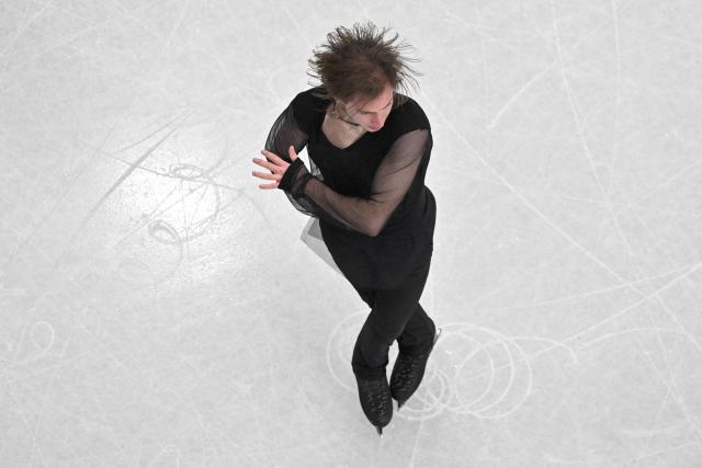 Georgia's Nika Egadze competes in the figure skating men's singles free skating final during the Milano Cortina 2026 Winter Olympic Games at Milano Ice Skating Arena in Milan on February 13, 2026. (Photo by Antonin THUILLIER / AFP)
