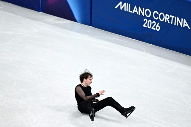 Georgia's Nika Egadze falls while competing in the figure skating men's singles free skating final during the Milano Cortina 2026 Winter Olympic Games at Milano Ice Skating Arena in Milan on February 13, 2026. (Photo by Gabriel BOUYS / AFP)