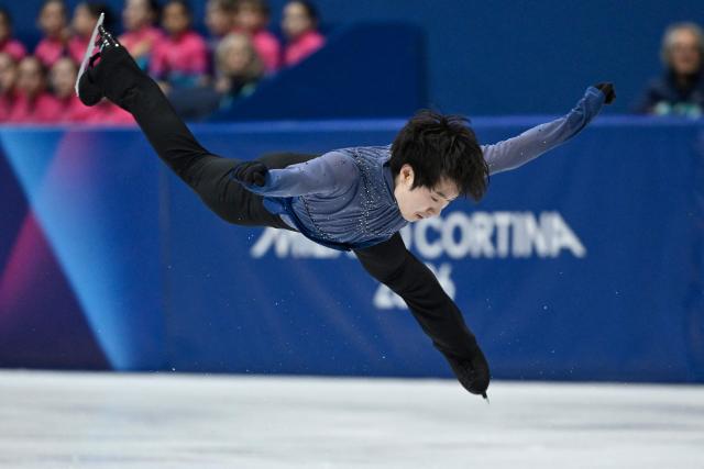 China's Jin Boyang competes in the figure skating men's singles free skating final during the Milano Cortina 2026 Winter Olympic Games at Milano Ice Skating Arena in Milan on February 13, 2026. (Photo by WANG Zhao / AFP)