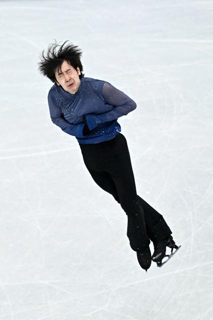 China's Jin Boyang competes in the figure skating men's singles free skating final during the Milano Cortina 2026 Winter Olympic Games at Milano Ice Skating Arena in Milan on February 13, 2026. (Photo by Gabriel BOUYS / AFP)