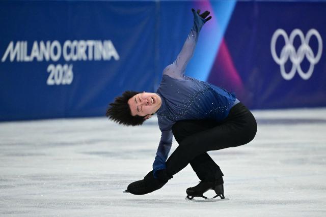 China's Jin Boyang competes in the figure skating men's singles free skating final during the Milano Cortina 2026 Winter Olympic Games at Milano Ice Skating Arena in Milan on February 13, 2026. (Photo by Piero CRUCIATTI / AFP)