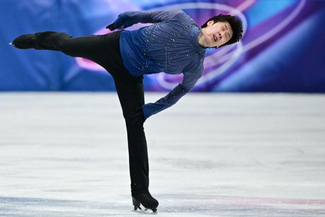 China's Jin Boyang competes in the figure skating men's singles free skating final during the Milano Cortina 2026 Winter Olympic Games at Milano Ice Skating Arena in Milan on February 13, 2026. (Photo by Piero CRUCIATTI / AFP)