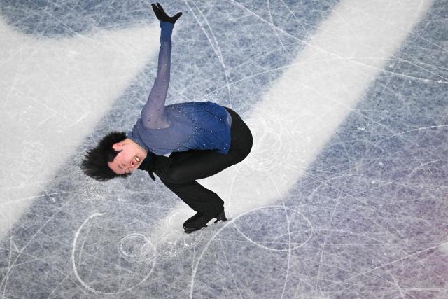 China's Jin Boyang competes in the figure skating men's singles free skating final during the Milano Cortina 2026 Winter Olympic Games at Milano Ice Skating Arena in Milan on February 13, 2026. (Photo by Antonin THUILLIER / AFP)