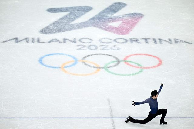 China's Jin Boyang competes in the figure skating men's singles free skating final during the Milano Cortina 2026 Winter Olympic Games at Milano Ice Skating Arena in Milan on February 13, 2026. (Photo by Gabriel BOUYS / AFP)