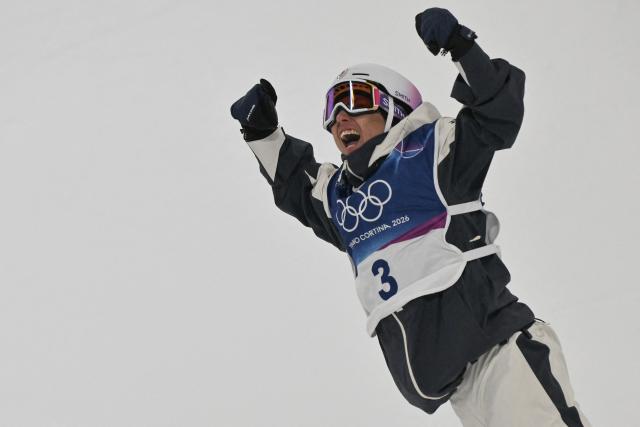 Japan's Ruka Hirano reacts after competing in the snowboard men's halfpipe final run 3 during the Milano Cortina 2026 Winter Olympic Games at Livigno Snow Park, in Livigno (Valtellina), on February 13, 2026. (Photo by Jeff PACHOUD / AFP)