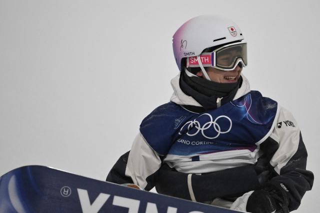 Japan's Yuto Totsuka reacts after competing in the snowboard men's halfpipe final run 3 during the Milano Cortina 2026 Winter Olympic Games at Livigno Snow Park, in Livigno (Valtellina), on February 13, 2026. (Photo by Jeff PACHOUD / AFP)