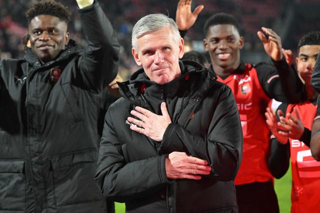 Rennes' French interim head coach Sebastien Tambouret (C) reacts after winning at the end of the French L1 football match between Stade Rennais FC and Paris Saint-Germain (PSG) at the Roazhon Park stadium in Rennes, western France, on February 13, 2026. (Photo by Damien MEYER / AFP)