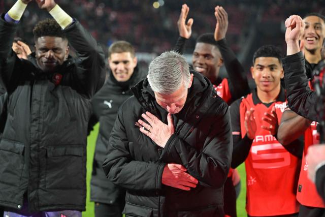 Rennes' French interim head coach Sebastien Tambouret (C) reacts after winning at the end of the French L1 football match between Stade Rennais FC and Paris Saint-Germain (PSG) at the Roazhon Park stadium in Rennes, western France, on February 13, 2026. (Photo by Damien MEYER / AFP)