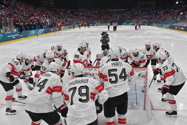 Swizterland's players gather before the  men's preliminary round Group A Ice Hockey match between Canada and Switzerland at the Milano Santagiulia Ice Hockey Arena during the Milano Cortina 2026 Winter Olympic Games in Milan, on February 13, 2026. (Photo by Alexander NEMENOV / POOL / AFP)