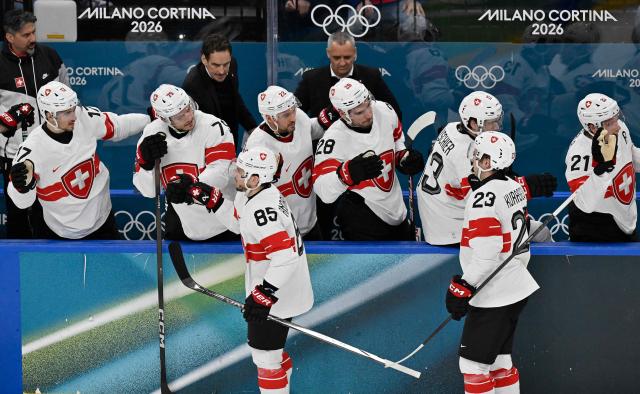 Swizterland's players celebrate a team goal  during the men's preliminary round Group A Ice Hockey match between Canada and Switzerland at the Milano Santagiulia Ice Hockey Arena during the Milano Cortina 2026 Winter Olympic Games in Milan, on February 13, 2026. (Photo by Alexander NEMENOV / AFP)