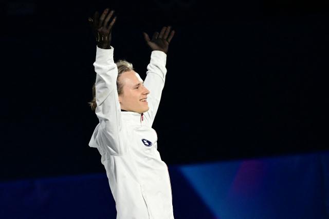 US' Ilia Malinin enters to warm up for the figure skating men's singles free skating final during the Milano Cortina 2026 Winter Olympic Games at Milano Ice Skating Arena in Milan on February 13, 2026. (Photo by Piero CRUCIATTI / AFP)