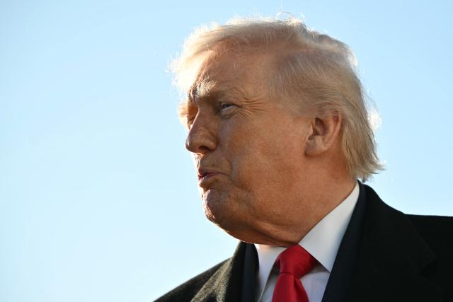 US President Donald Trump speaks to the press before boarding Air Force One at Pope Army Airfield at Fort Bragg, North Carolina on February 13, 2026, on his way to Palm Beach, Florida, to spend the weekend. (Photo by Mandel NGAN / AFP)