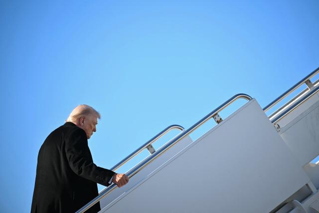 US President Donald Trump boards Air Force One at Pope Army Airfield at Fort Bragg, North Carolina on February 13, 2026, on his way to Palm Beach, Florida, to spend the weekend. (Photo by Mandel NGAN / AFP)