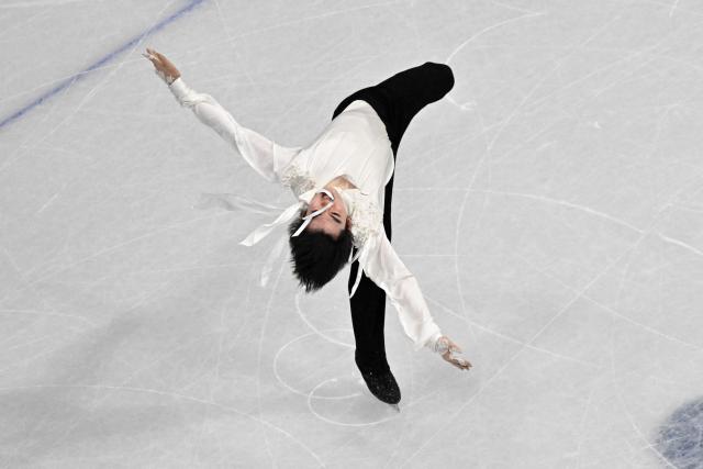 South Korea's Cha Junhwan competes in the figure skating men's singles free skating final during the Milano Cortina 2026 Winter Olympic Games at Milano Ice Skating Arena in Milan on February 13, 2026. (Photo by Antonin THUILLIER / AFP)