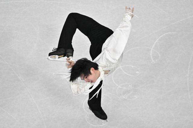 South Korea's Cha Junhwan competes in the figure skating men's singles free skating final during the Milano Cortina 2026 Winter Olympic Games at Milano Ice Skating Arena in Milan on February 13, 2026. (Photo by Antonin THUILLIER / AFP)