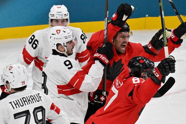 Canada's #87 Sidney Crosby (R) celebrates after scoring a goal during the men's preliminary round Group A Ice Hockey match between Canada and Switzerland at the Milano Santagiulia Ice Hockey Arena during the Milano Cortina 2026 Winter Olympic Games in Milan, on February 13, 2026. (Photo by Alexander NEMENOV / AFP)