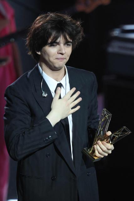 French singer Sam Sauvage reacts after receiving the Male Revelation award during the Victoires de la Musique music awards ceremony at La Seine Musicale in Boulogne-Billancourt on February 13, 2026. (Photo by Alain JOCARD / AFP)