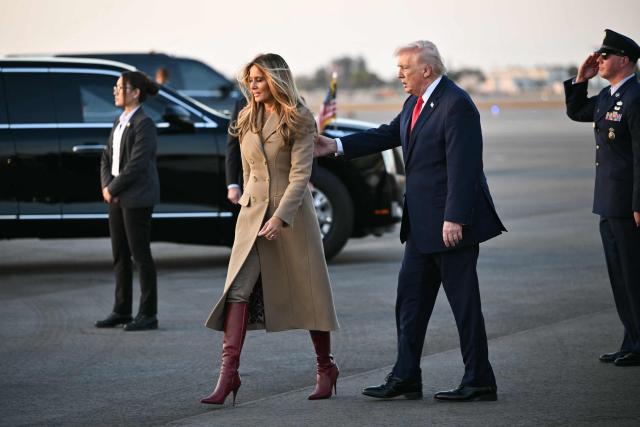 US President Donald Trump and First Lady Melania Trump walk to the motorcade after exiting Air Force One upon arrival at Palm Beach International Airport in West Palm Beach, Florida on February 13, 2026. Trump is spending the weekend at his Mar-a-Lago residence in Palm Beach. (Photo by Mandel NGAN / AFP)