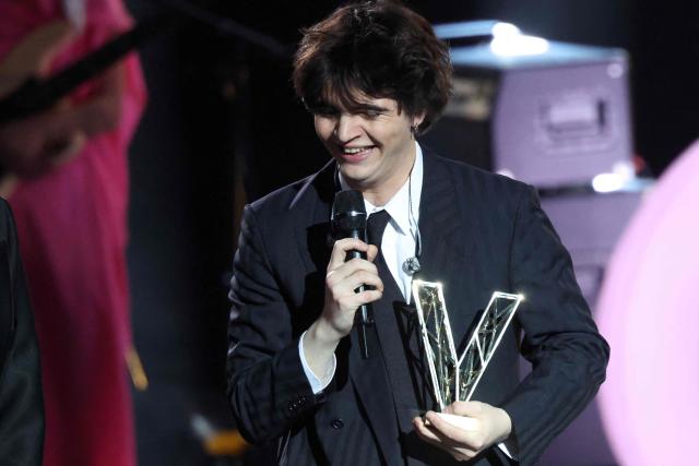 French singer Sam Sauvage reacts after receiving the Male Revelation award during the Victoires de la Musique music awards ceremony at La Seine Musicale in Boulogne-Billancourt on February 13, 2026. (Photo by Alain JOCARD / AFP)