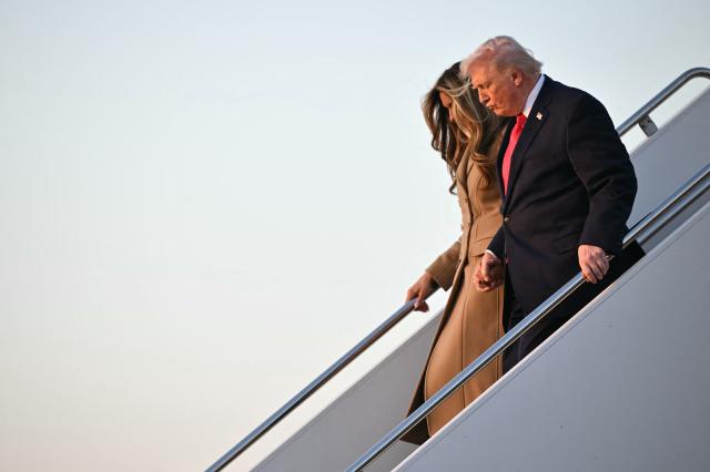US President Donald Trump and First Lady Melania Trump step off Air Force One upon arrival at Palm Beach International Airport in West Palm Beach, Florida on February 13, 2026. Trump is spending the weekend at his Mar-a-Lago residence in Palm Beach. (Photo by Mandel NGAN / AFP)