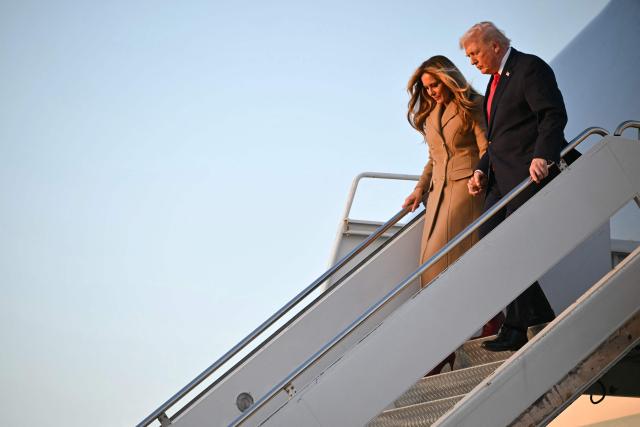 US President Donald Trump and First Lady Melania Trump step off Air Force One upon arrival at Palm Beach International Airport in West Palm Beach, Florida on February 13, 2026. Trump is spending the weekend at his Mar-a-Lago residence in Palm Beach. (Photo by Mandel NGAN / AFP)