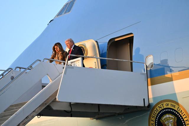 US President Donald Trump and First Lady Melania Trump step off Air Force One upon arrival at Palm Beach International Airport in West Palm Beach, Florida on February 13, 2026. Trump is spending the weekend at his Mar-a-Lago residence in Palm Beach. (Photo by Mandel NGAN / AFP)