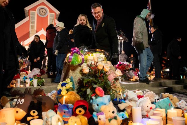 People gather for a vigil after the community experienced one of Canada’s deadliest shootings in Tumbler Ridge, British Columbia, on February 13, 2026. (Photo by Paige Taylor White / AFP)