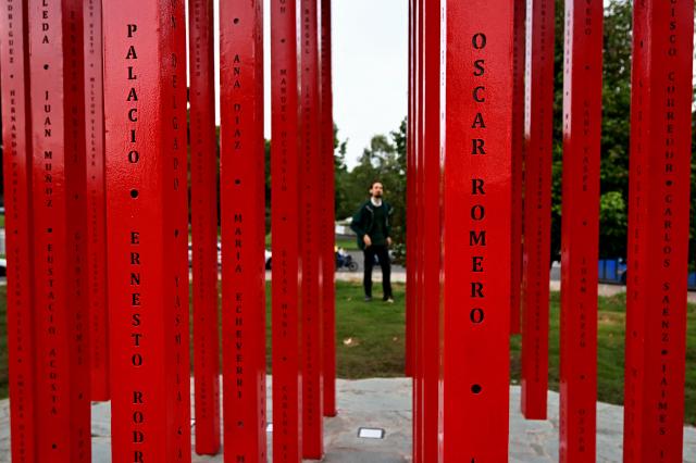TOPSHOT - A detailed view of the New “Umbral” monument, which pays tribute to medical personnel who died during the Covid-19 pandemic, is pictured in Bogota on February 13, 2026. Created by Colombian artist Carlos Castro, it honors those who lost their lives during the pandemic. Standing over 11 meters high and 7 meters wide, it is represented by the universal symbol of the cross, an emblem conceived to protect life in hostile scenarios and, since its origins, to evoke the presence of medical personnel providing aid, neutrality, and humanity. (Photo by Raul ARBOLEDA / AFP)