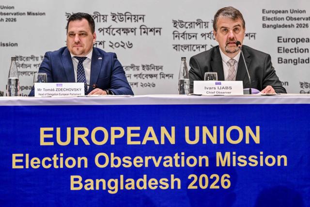TOPSHOT - European Union Election Observation Mission (EU EOM) Chief Observer Ivars Ijabs (R) and Tomas Zdechovsky, Head of the European Parliament delegation, attend a press conference presenting a preliminary statement on Bangladesh's general election in Dhaka on February 14, 2026. Bangladesh's elections, in which the nationalist party won a landslide victory in the first polls since a 2024 uprising, were credible, European Union observers said on February 14. (Photo by Munir UZ ZAMAN / AFP)