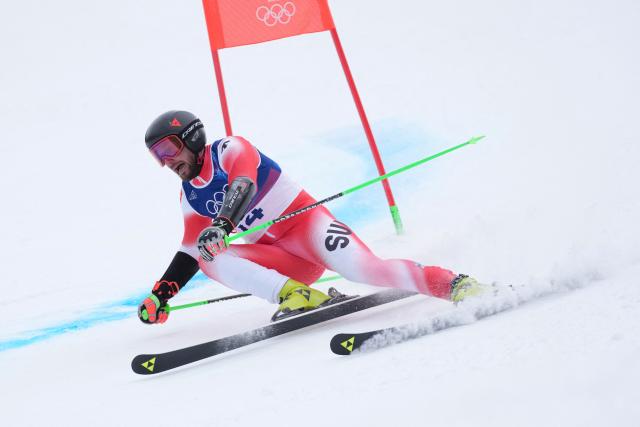 Switzerland's Luca Aerni competes in the first run of the men's giant slalom alpine skiing event during the Milano Cortina 2026 Winter Olympic Games at the Stelvio Ski Centre in Bormio (Valtellina) on February 14, 2026. (Photo by Dimitar DILKOFF / AFP)