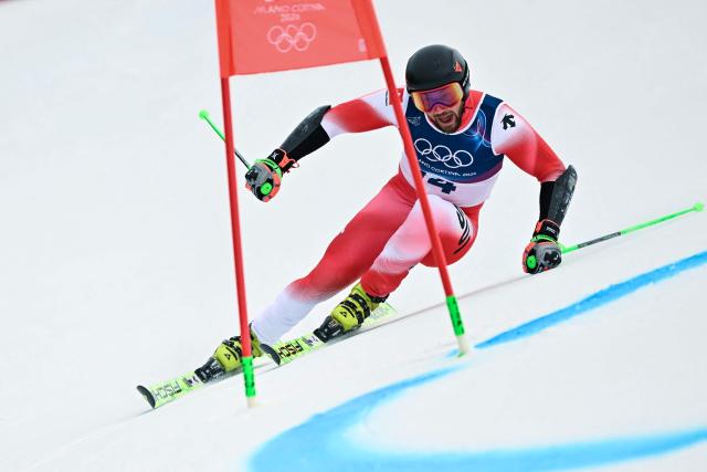 Switzerland's Luca Aerni passes a gate in the first run of the men's giant slalom alpine skiing event during the Milano Cortina 2026 Winter Olympic Games at the Stelvio Ski Centre in Bormio (Valtellina) on February 14, 2026. (Photo by Fabrice COFFRINI / AFP)