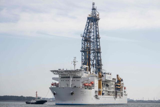 Japan's deep-sea drilling vessel Chikyu is escorted by a tug boat as it returns to Shimizu port in Shimizu, Shizuoka prefecture on February 14, 2026. (Photo by Yuichi YAMAZAKI / AFP)
