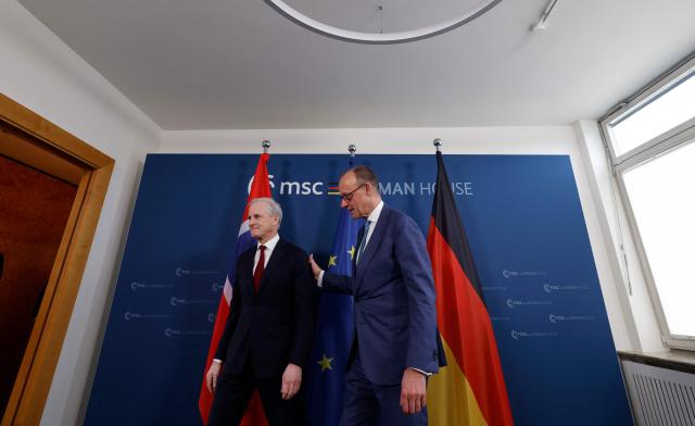 German Chancellor Friedrich Merz (R) and Norwegian Prime Minister Jonas Gahr Store attend a bilateral meeting at the 62nd Munich Security Conference (MSC) on February 14, 2026 in Munich, southern Germany. (Photo by Michaela STACHE / AFP)