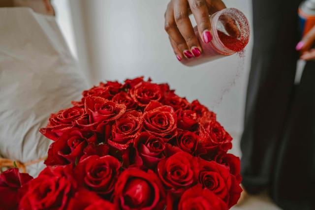 Lauryne from Wild Flower Gifting prepares a rose bouquet for delivery on the eve of Valentine’s Day in Nairobi, on February 13, 2026. (Photo by Fredrik Lerneryd / AFP)