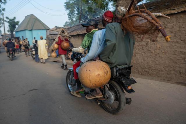 Fishermen carry calabash on a motorcycle as they get ready to attend the Argungu Fishing and Cultural Festival at Argungu Town, Kebbi State in northwestern Nigeria, on February 14, 2026. (Photo by TOYIN ADEDOKUN / AFP)