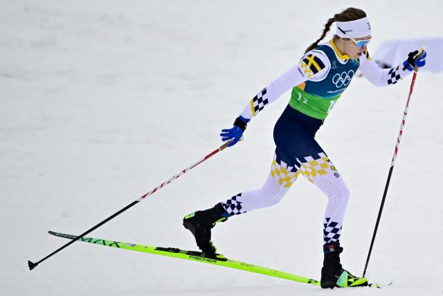 Sweden's Ebba Andersson competes during the cross-country women's 4 x 7,5km relay event of the Milano Cortina 2026 Winter Olympic Games at Tesero Cross-Country Skiing Stadium in Lago di Tesero (Val di Fiemme), on February 14, 2026. (Photo by Tobias SCHWARZ / AFP)