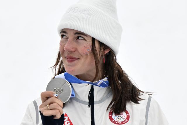 Silver medallist USA's Jaelin Kauf celebrates on the podium after the freestyle skiing women's dual moguls final during the Milano Cortina 2026 Winter Olympic Games at Livigno Aerials & Moguls Park, in Livigno (Valtellina), on February 14, 2026. (Photo by Jeff PACHOUD / AFP)