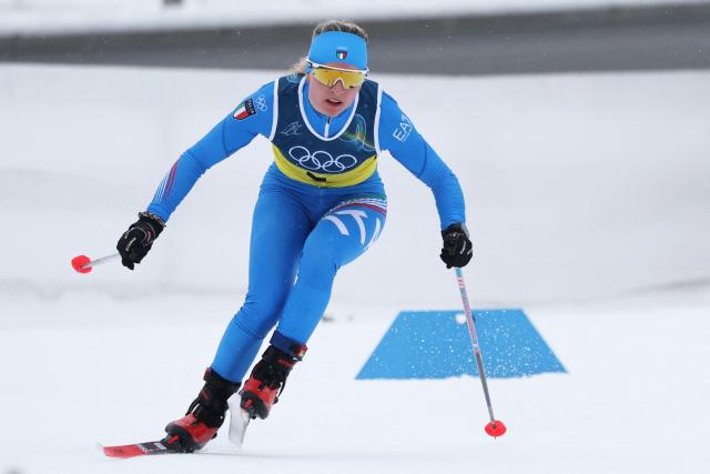 Italy's Martina di Centa competes during the cross-country women's 4 x 7,5km relay event of the Milano Cortina 2026 Winter Olympic Games at Tesero Cross-Country Skiing Stadium in Lago di Tesero (Val di Fiemme), on February 14, 2026. (Photo by Anne-Christine POUJOULAT / AFP)