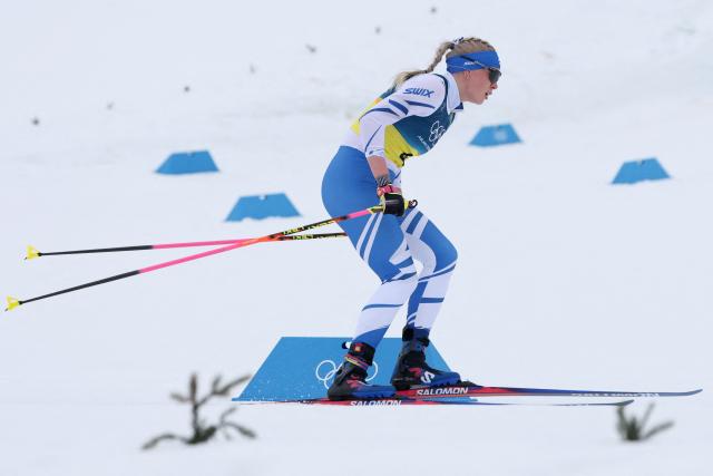 Finland's Vilma Ryytty competes during the cross-country women's 4 x 7,5km relay event of the Milano Cortina 2026 Winter Olympic Games at Tesero Cross-Country Skiing Stadium in Lago di Tesero (Val di Fiemme), on February 14, 2026. (Photo by Anne-Christine POUJOULAT / AFP)