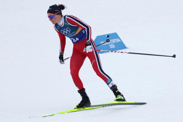 Norway's Heidi Weng competes during the cross-country women's 4 x 7,5km relay event of the Milano Cortina 2026 Winter Olympic Games at Tesero Cross-Country Skiing Stadium in Lago di Tesero (Val di Fiemme), on February 14, 2026. (Photo by Anne-Christine POUJOULAT / AFP)